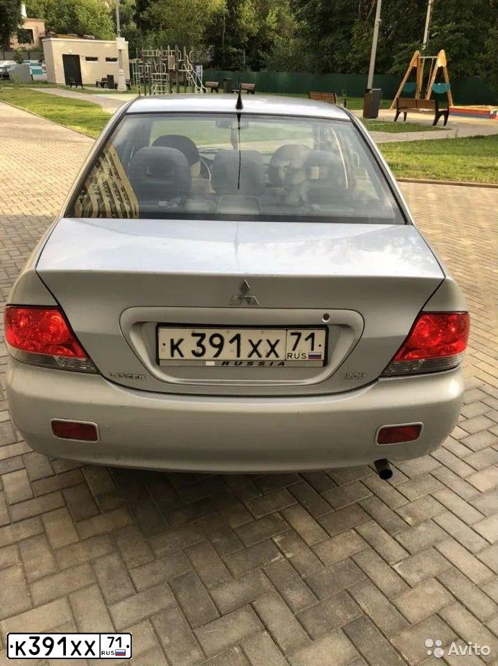Фото автомобиля MITSUBISHI LANCER, 2005 — госномер Н113НЕ82. Цвет: СЕРЕБРИСТЫЙ