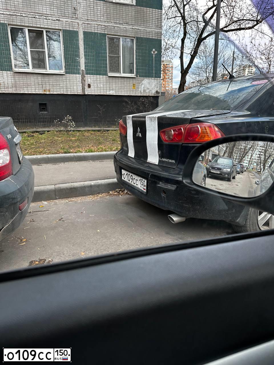 Фото автомобиля MITSUBISHI LANCER, 2008 — госномер О109СС150. Цвет: ЧЕРНЫЙ