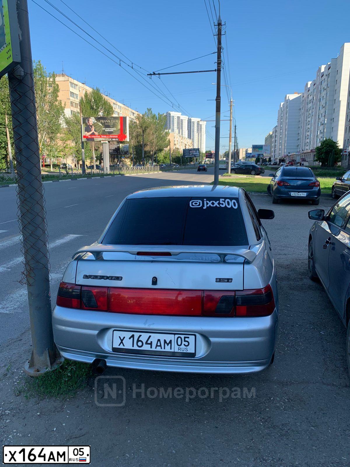 Фото автомобиля LADA 2110, 2002 — госномер Х164АМ05. Цвет: СЕРО-ГОЛУБОЙ