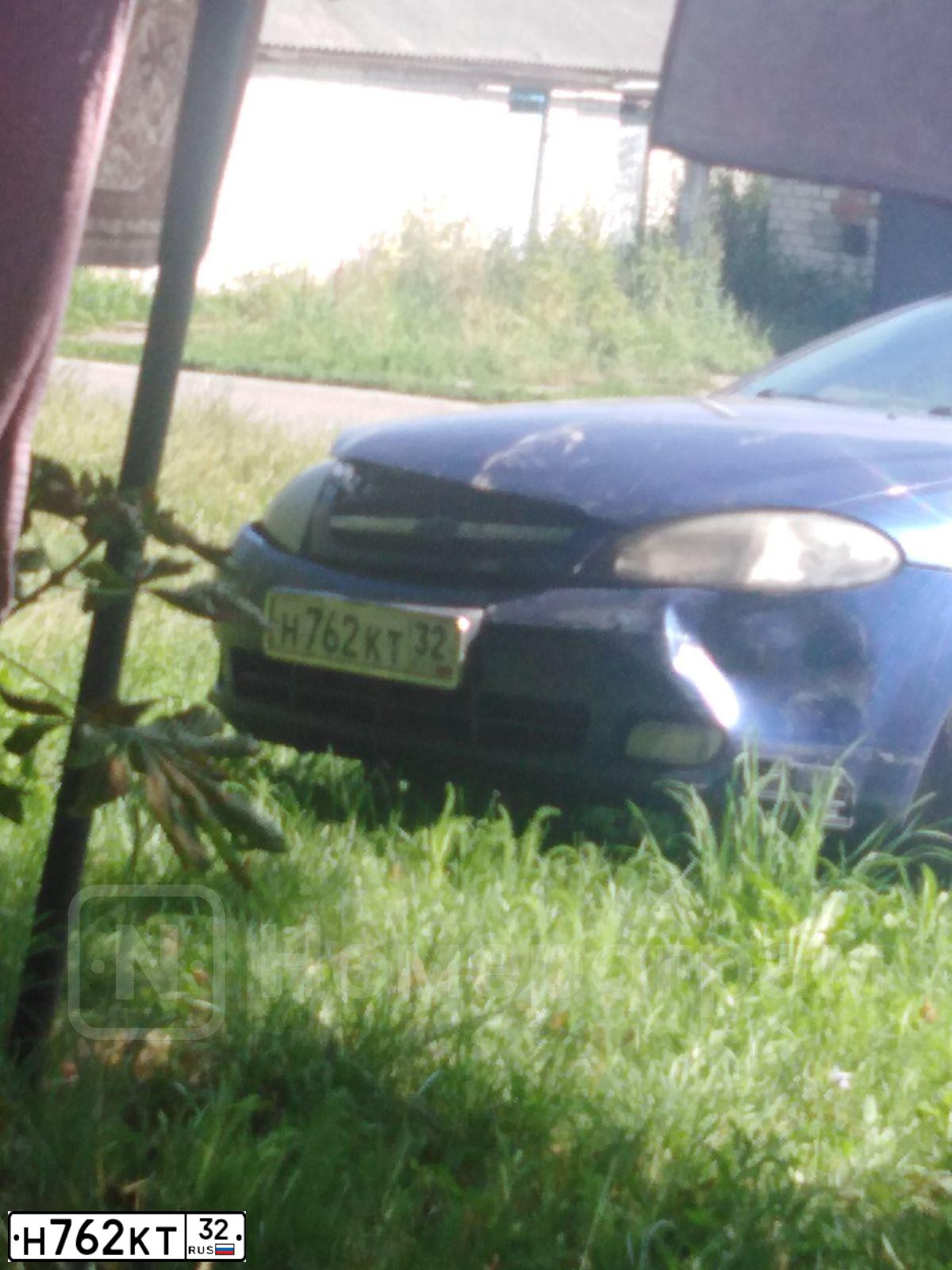 Фото автомобиля CHEVROLET LACETTI, 2008 — госномер О030ХХ32. Цвет: синий