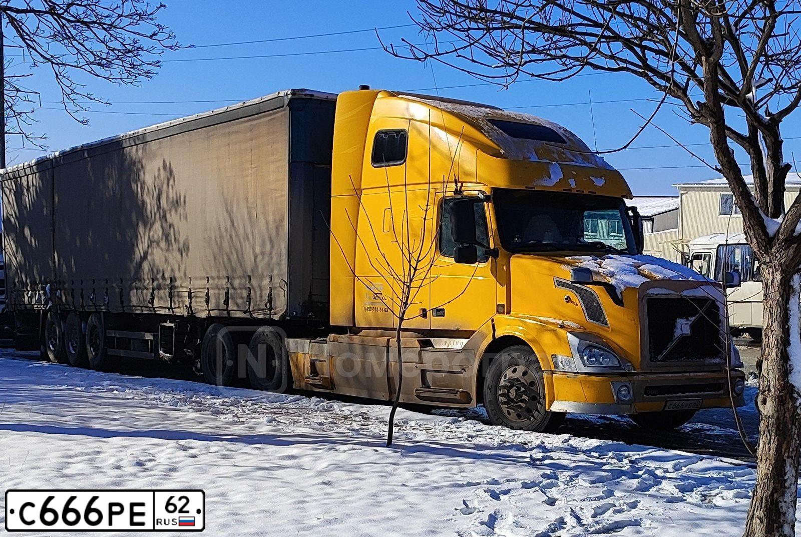 Фото автомобиля VOLVO SERIE VNL /6X4/, 2003 — госномер С666РЕ62. Цвет: ЖЕЛТЫЙ