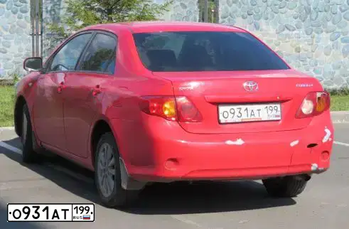 Фото автомобиля TOYOTA COROLLA, 2007 — госномер М515УТ10. Цвет: КРАСНЫЙ