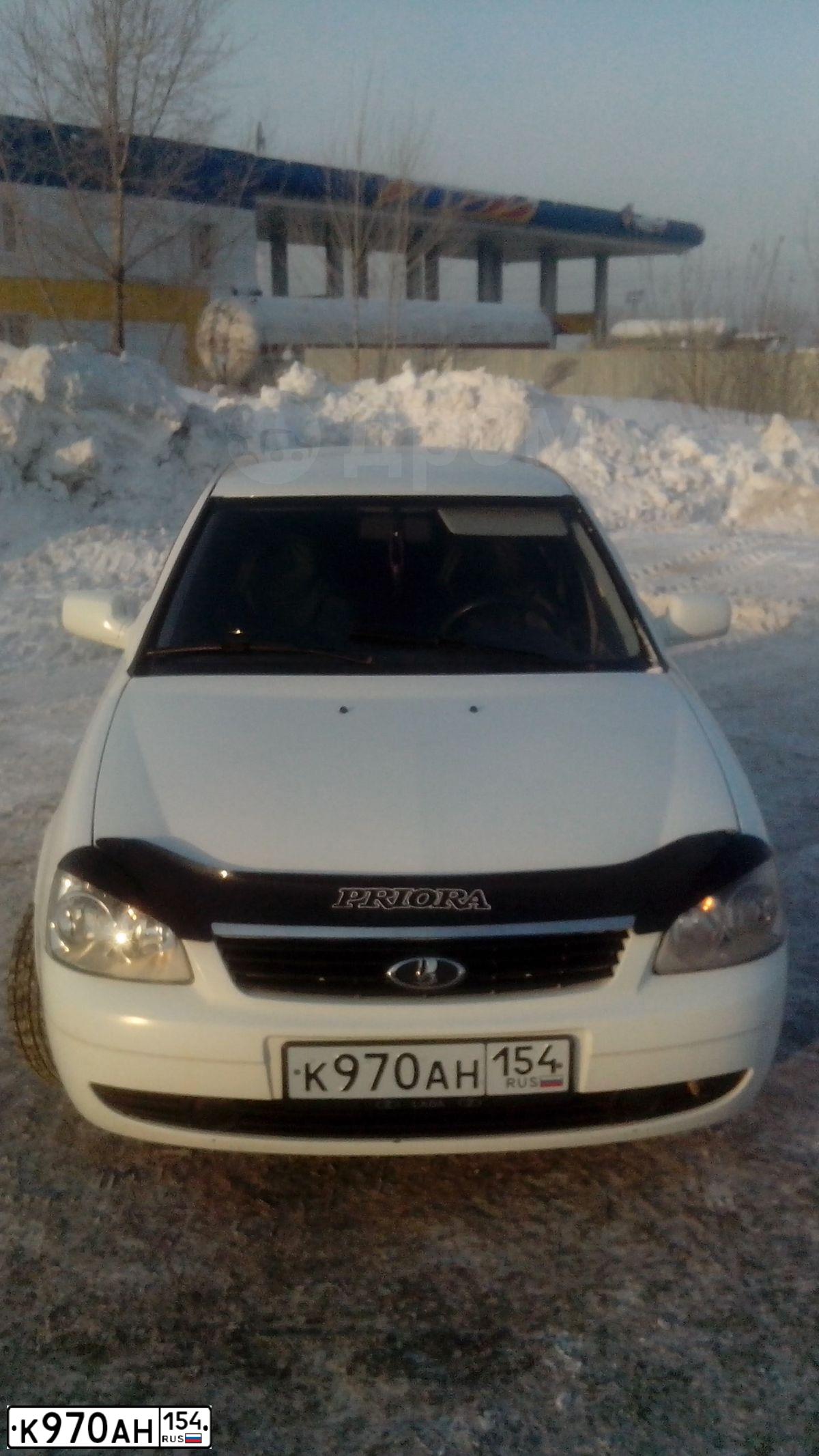 Фото автомобиля LADA 2172 PRIORA, 2009 — госномер Е125СУ154. Цвет: Белый