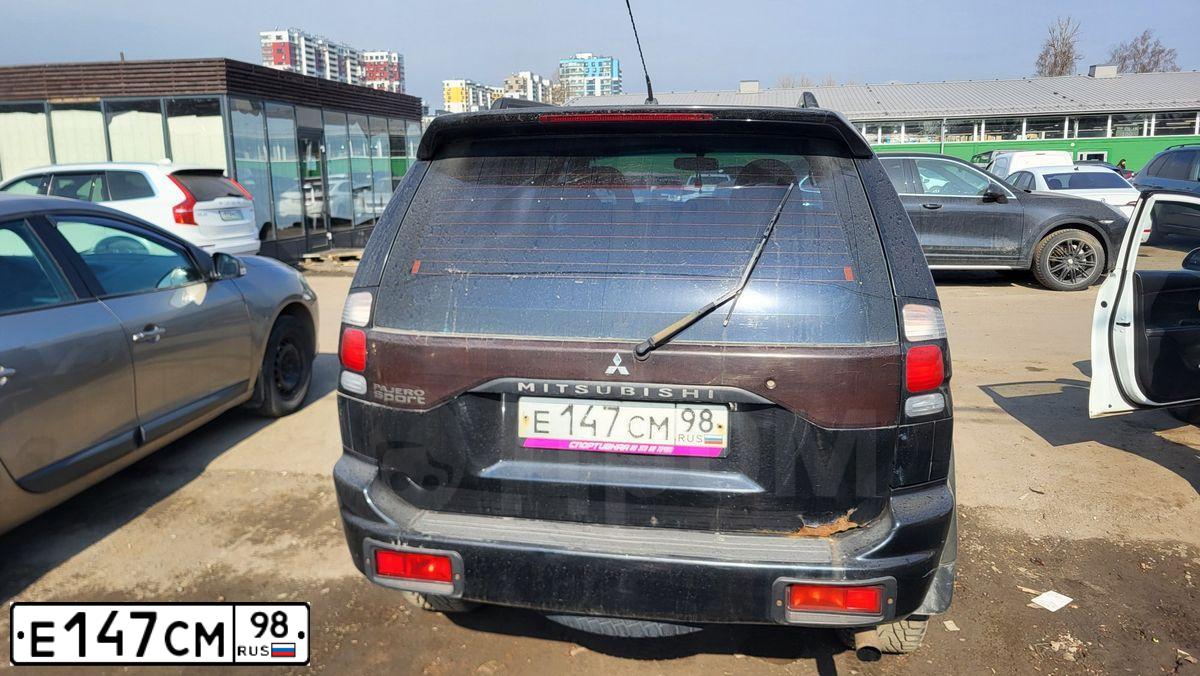 Фото автомобиля MITSUBISHI PAJERO SPORT, 2005 — госномер Е147СМ98. Цвет: ЧЕРНЫЙ