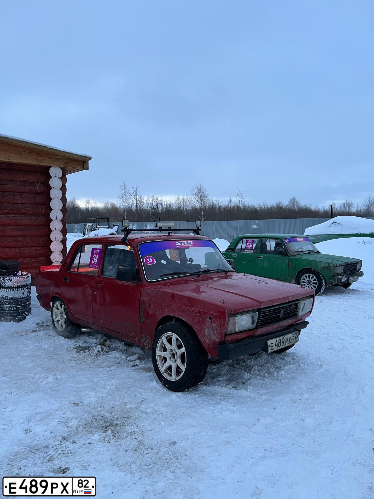 Фото автомобиля LADA 2107, 2007 — госномер Е489РХ82. Цвет: ВИШНЕВЫЙ