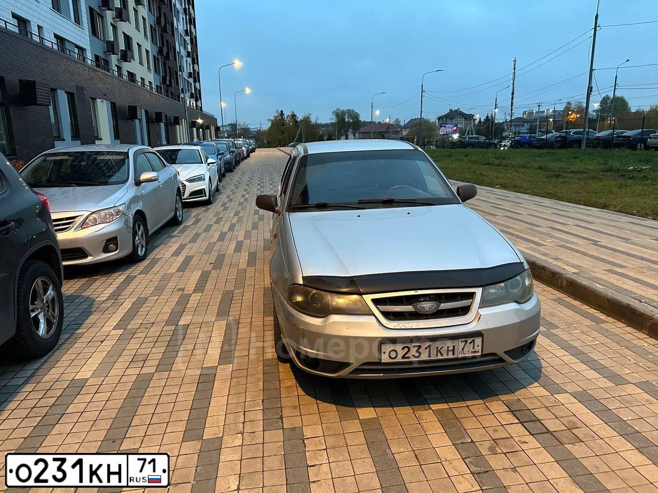 Фото автомобиля DAEWOO NEXIA, 2012 — госномер О231КН71. Цвет: Серебристый