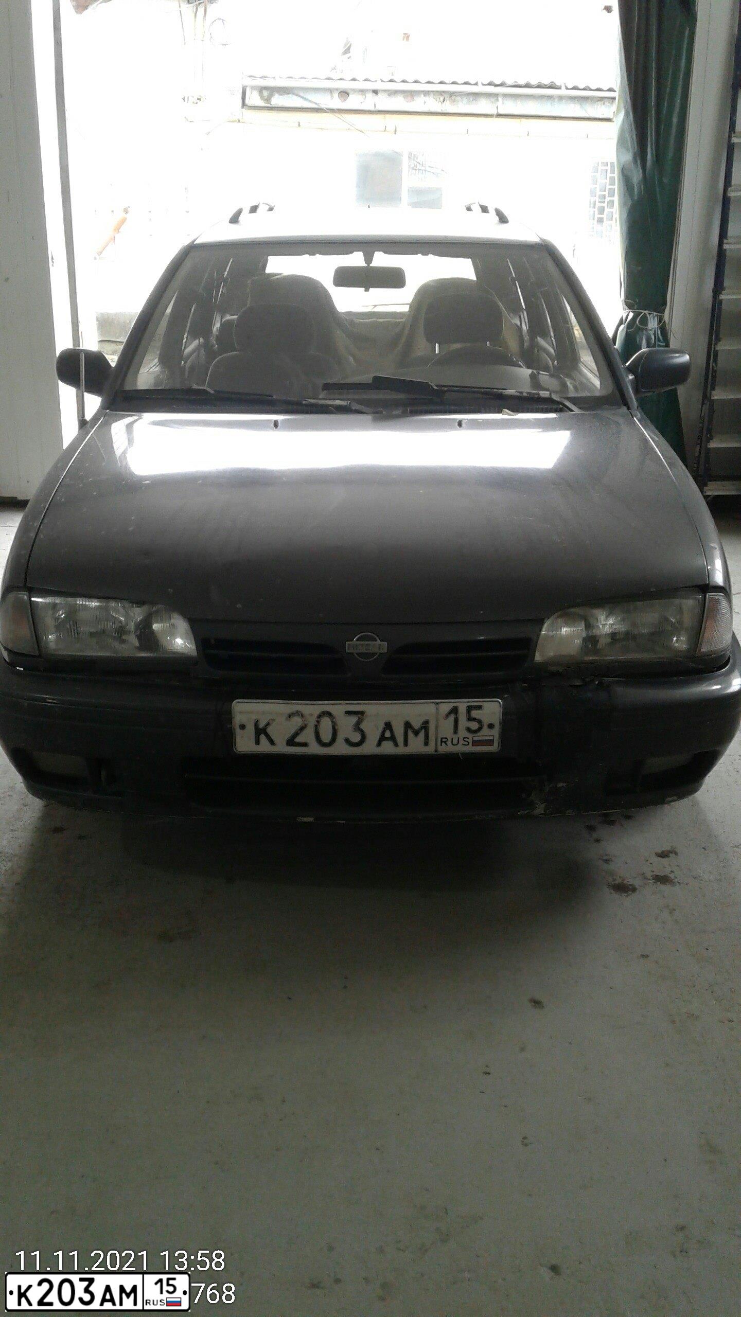 Фото автомобиля NISSAN PRIMERA, 1992 — госномер К203АМ15. Цвет: ТЕМНО-СЕРЫЙ