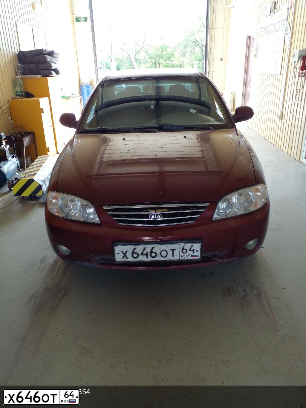 Фото автомобиля KIA SPECTRA, 2006 — госномер Х646ОТ64. Цвет: КРАСНЫЙ ПЕРЕЦ