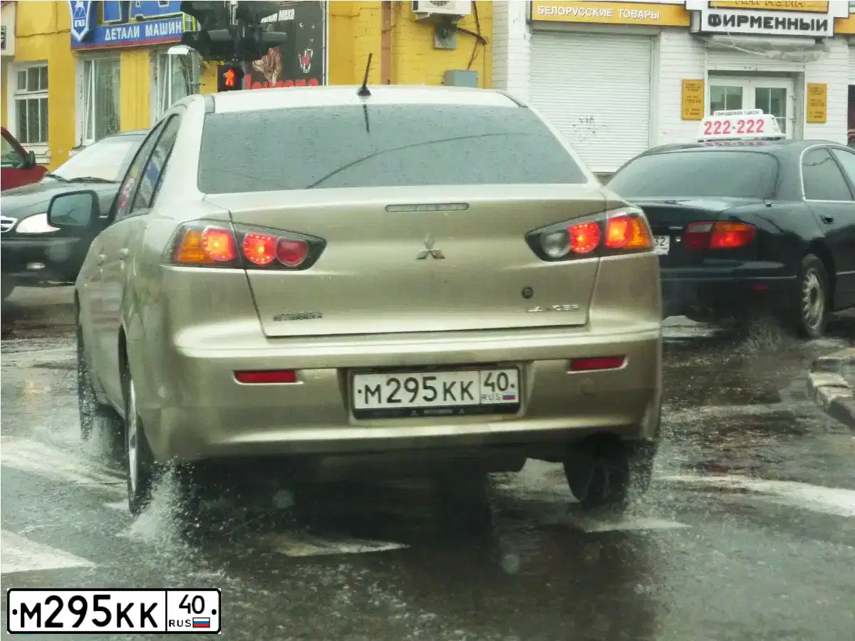 Фото автомобиля MITSUBISHI LANCER, 2010 — госномер М295КК40. Цвет: БЕЖЕВЫЙ