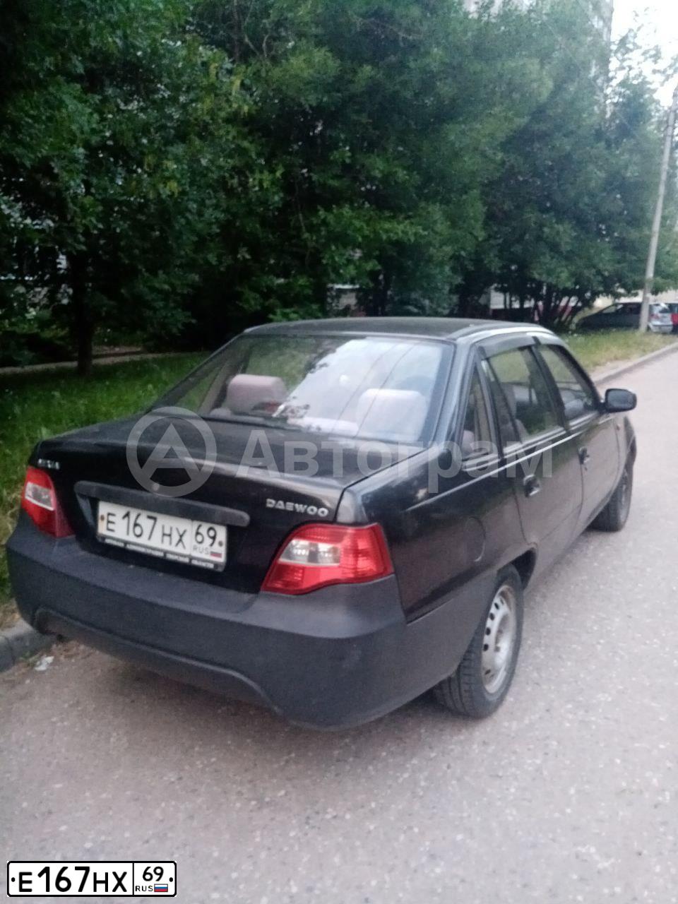 Фото автомобиля DAEWOO NEXIA, 2010 — госномер Е167НХ69. Цвет: БЛЕДНО ЧЕРНЫЙ
