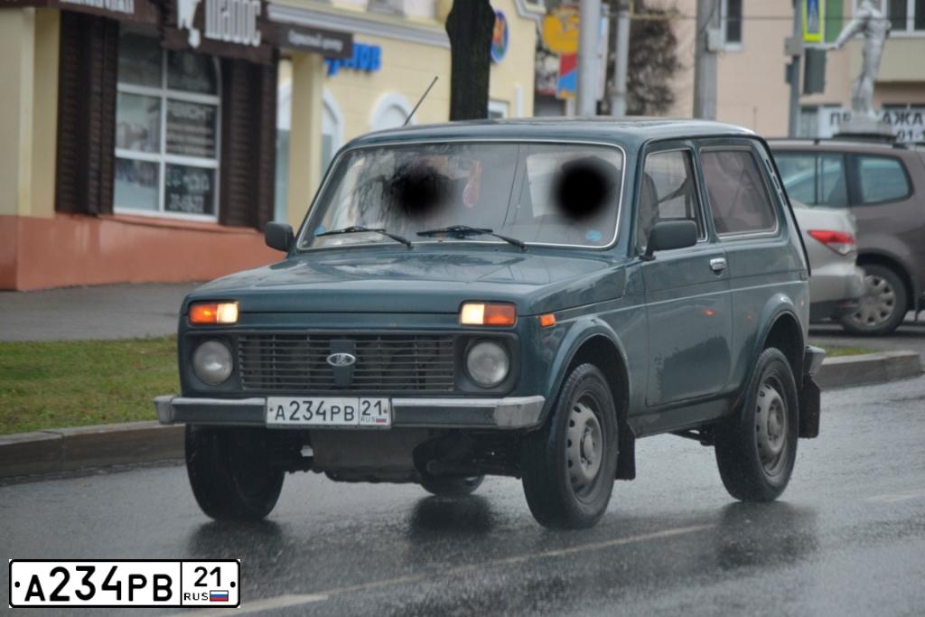 Фото автомобиля LADA 2121 NIVA, 2009 — госномер А234РВ21. Цвет: Темно-зеленый