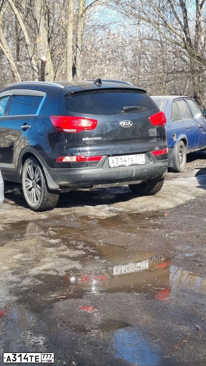 Фото автомобиля KIA SPORTAGE, 2015 — госномер А314ТЕ777. Цвет: ЧЕРНЫЙ ПЕРЛАМУТР