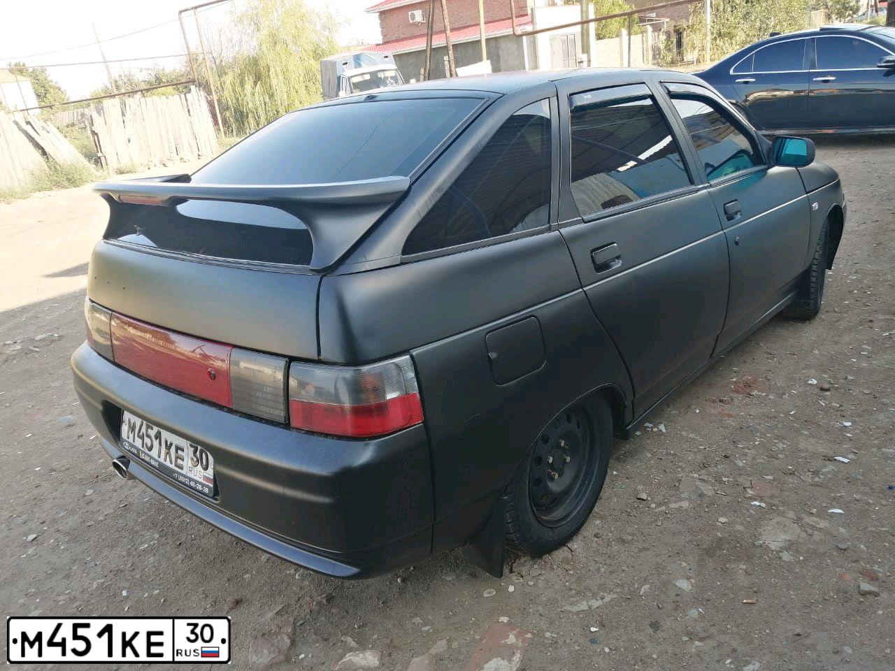 Фото автомобиля LADA 2112 LADA, 2003 — госномер М451КЕ30. Цвет: ЧЕРНЫЙ
