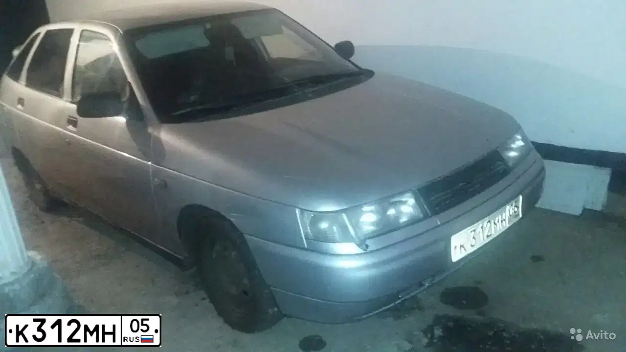 Фото автомобиля LADA 2112, 2003 — госномер К312МН05. Цвет: СВЕТЛО-СЕРЕБРИСТ МЕТАЛЛИК
