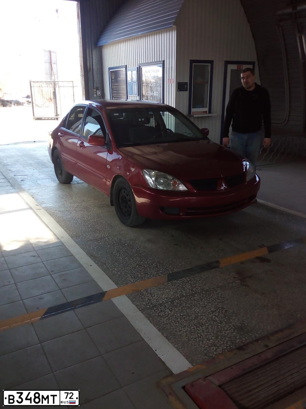 Фото автомобиля MITSUBISHI LANCER, 2005 — госномер В348МТ72. Цвет: Красный