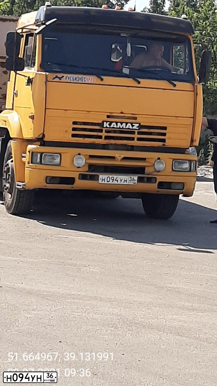 Фото автомобиля KAMAZ 65116 /6X4/, 2011 — госномер Н094УН36. Цвет: ЖЕЛТЫЙ