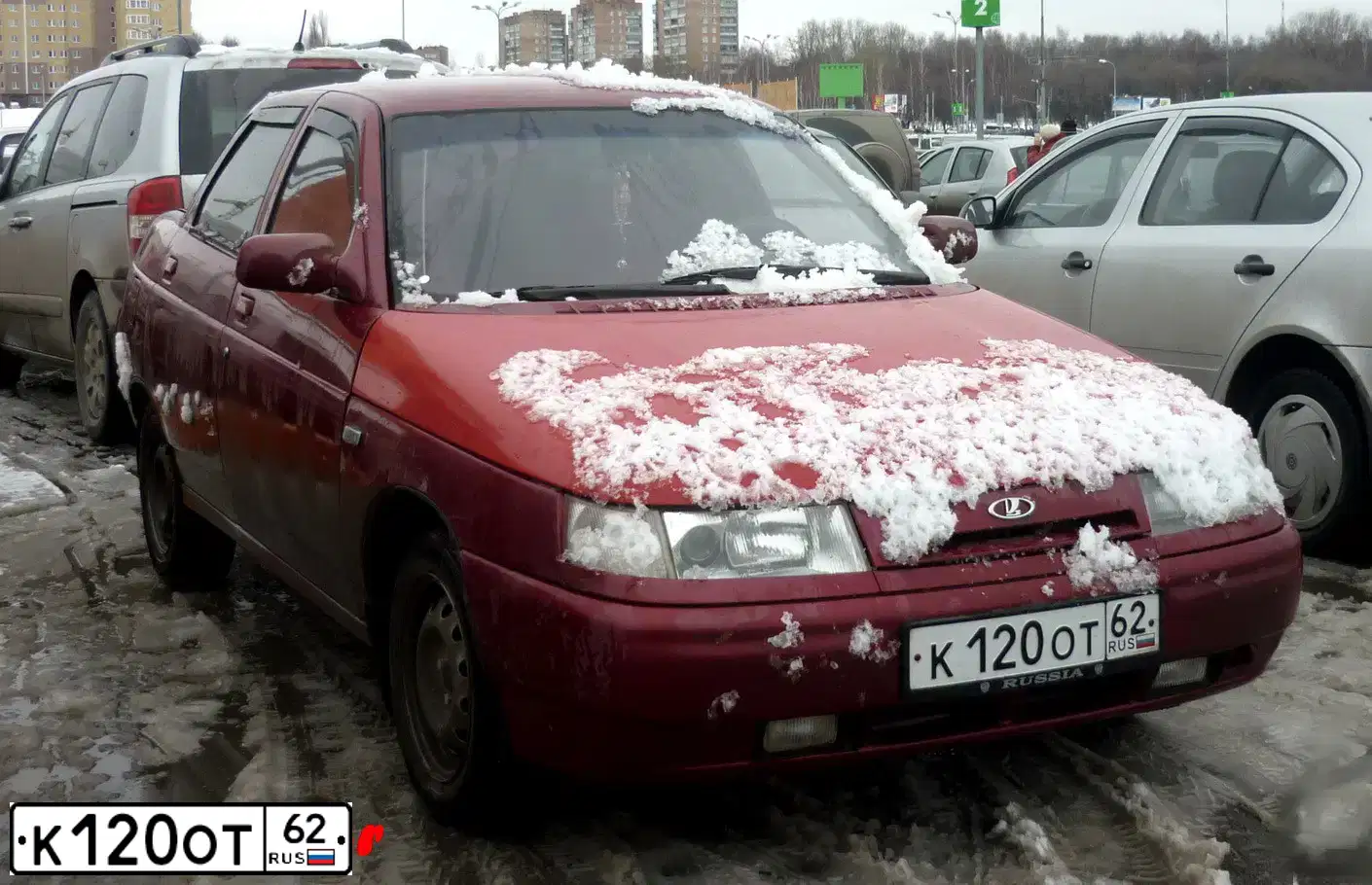 Фото автомобиля LADA 2110, 2001 — госномер К120ОТ62. Цвет: серебристо ярко-красный