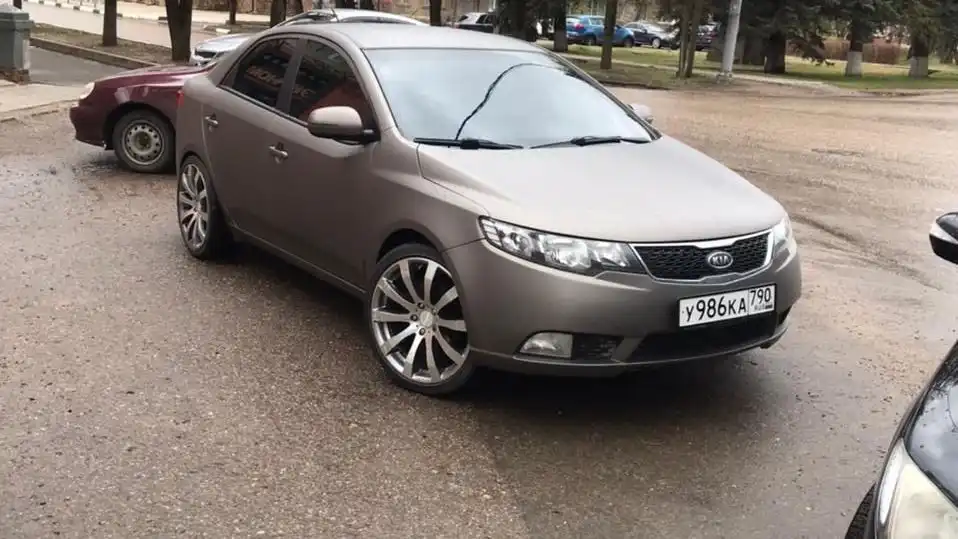 Фото автомобиля KIA CERATO, 2011 — госномер М779ВК13. Цвет: бронзовый