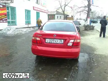 Фото автомобиля NISSAN ALMERA, 2005 — госномер С009КР36. Цвет: Красный