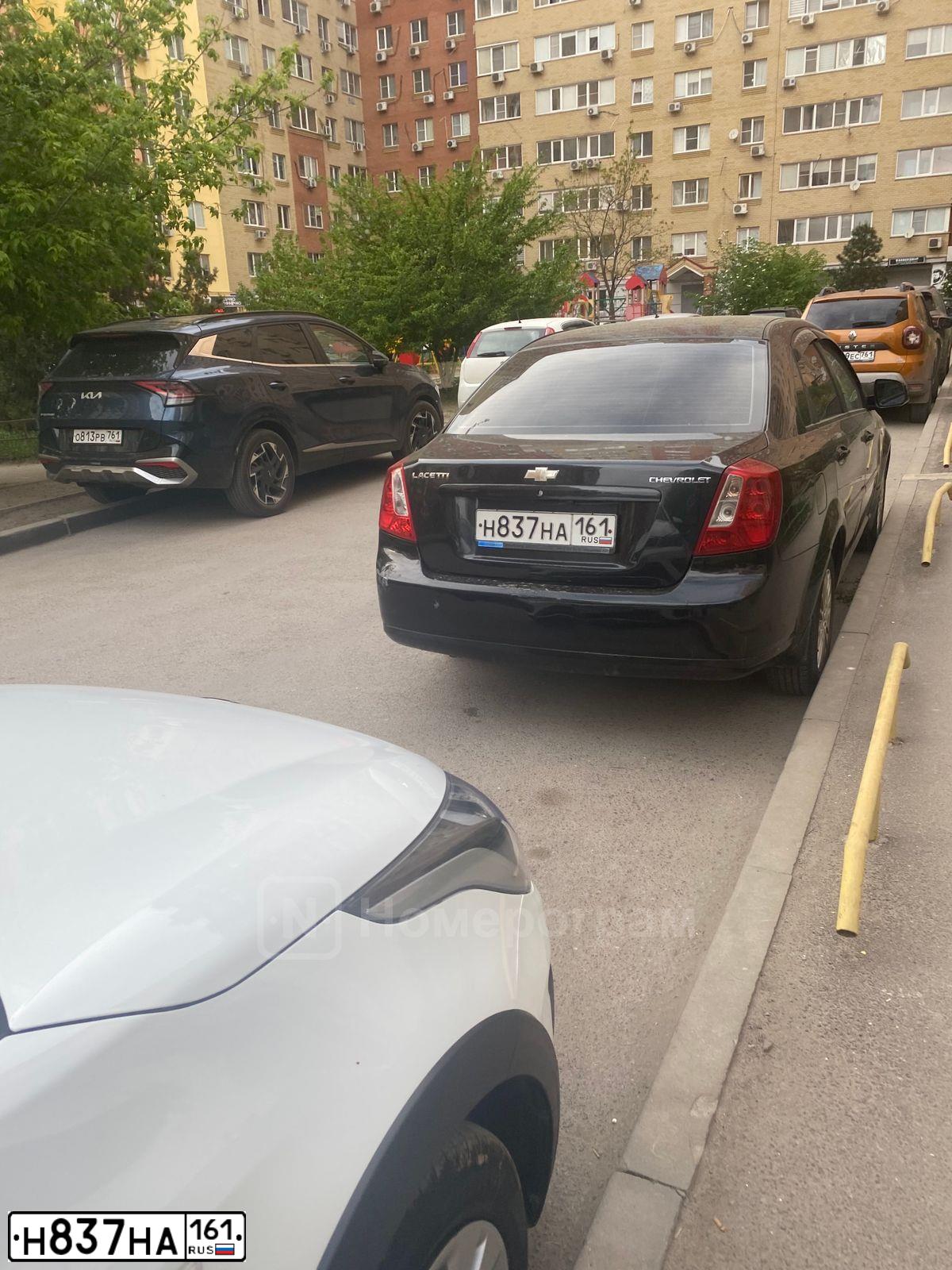 Фото автомобиля CHEVROLET LACETTI, 2011 — госномер Н837НА161. Цвет: ЧЕРНЫЙ
