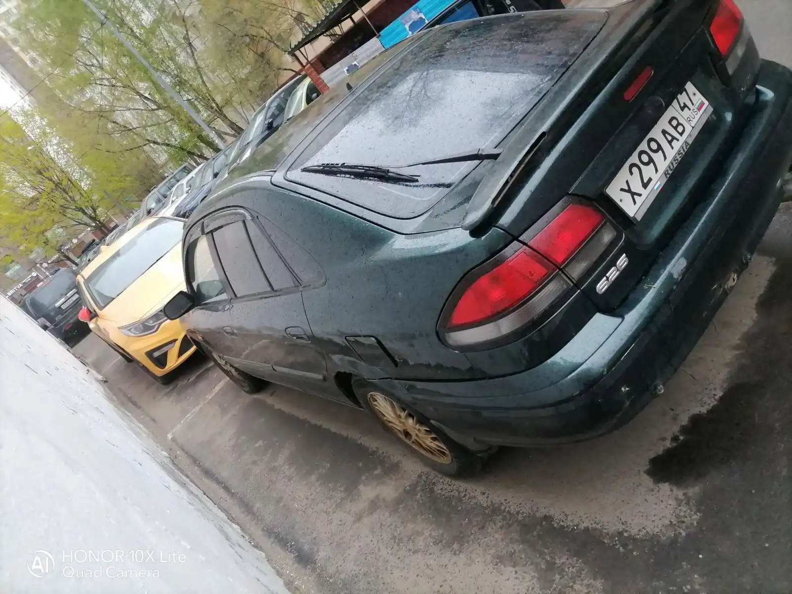 Фото автомобиля MAZDA A 626, 1998 — госномер Х299АВ47. Цвет: ЗЕЛЕНЫЙ