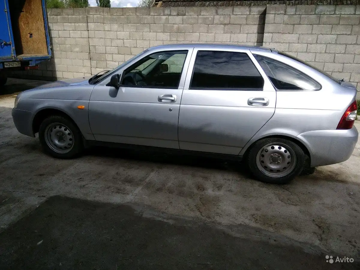 Фото автомобиля LADA 2190 GRANTA, 2012 — госномер Н242ТН26. Цвет: Белый