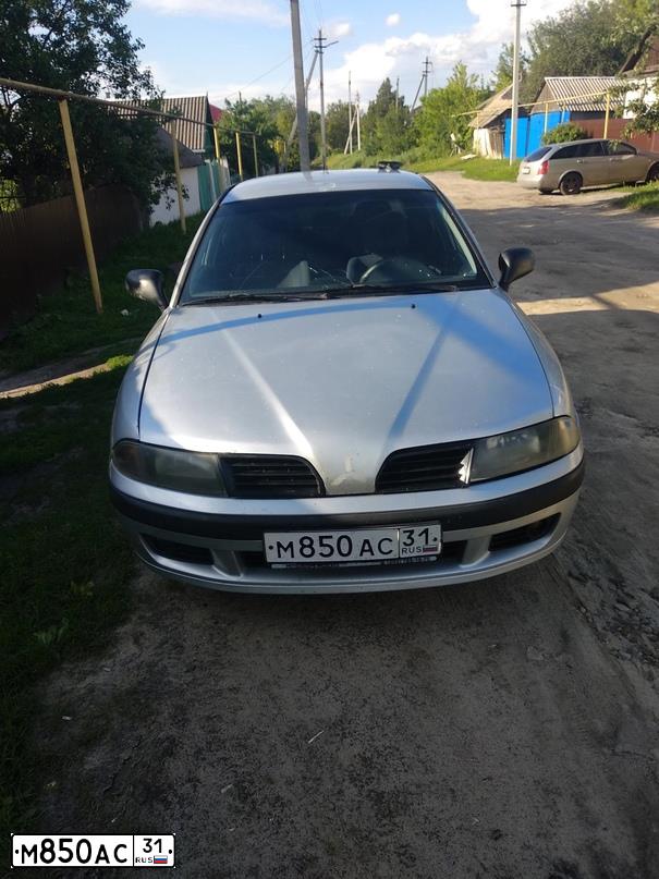 Фото автомобиля MITSUBISHI CARISMA, 2003 — госномер Х030ВХ31. Цвет: СЕРЕБРИСТЫЙ