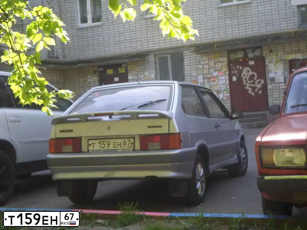 Фото автомобиля LADA 2113 SAMARA, 2006 — госномер А703РО67. Цвет: СЕРЕБРИСТЫЙ