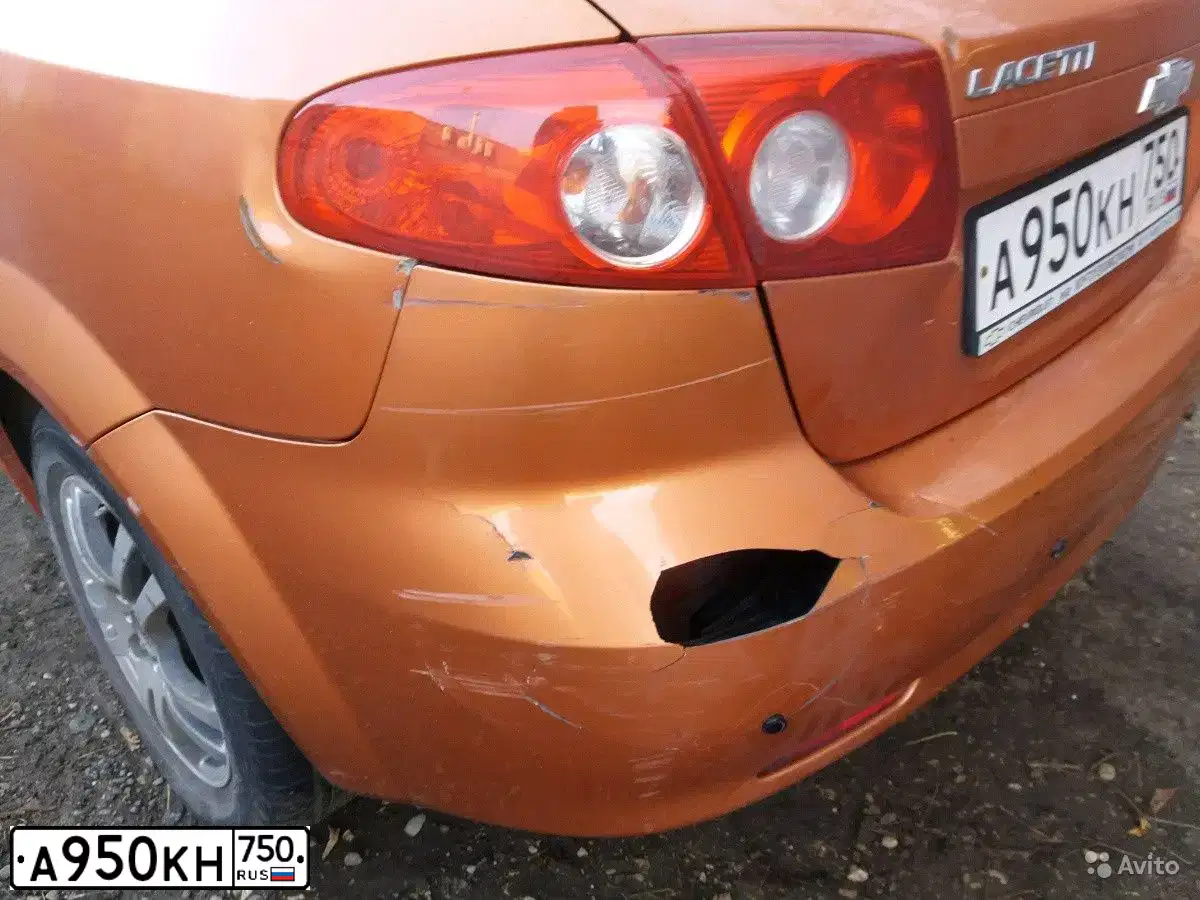 Фото автомобиля CHEVROLET LACETTI, 2006 — госномер Е320МК177. Цвет: ОРАНЖЕВЫЙ