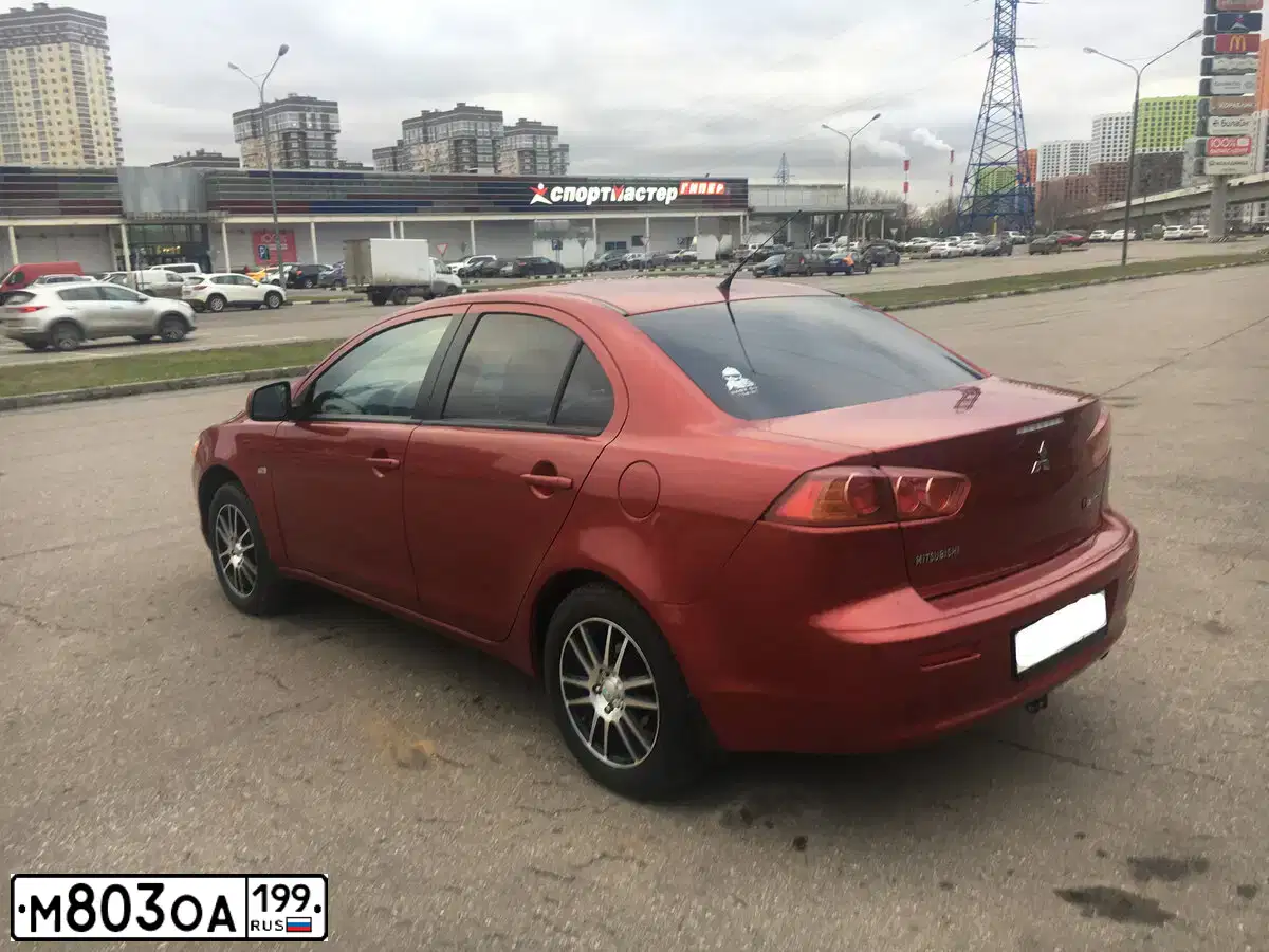 Фото автомобиля MITSUBISHI LANCER, 2007 — госномер Т616РМ790. Цвет: Красный