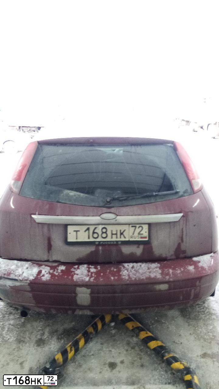 Фото автомобиля FORD FOCUS, 2002 — госномер Т168НК72. Цвет: Красный