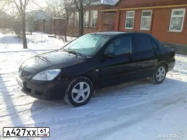 Фото автомобиля MITSUBISHI LANCER, 2004 — госномер А427ХХ61. Цвет: ЧЕРНЫЙ