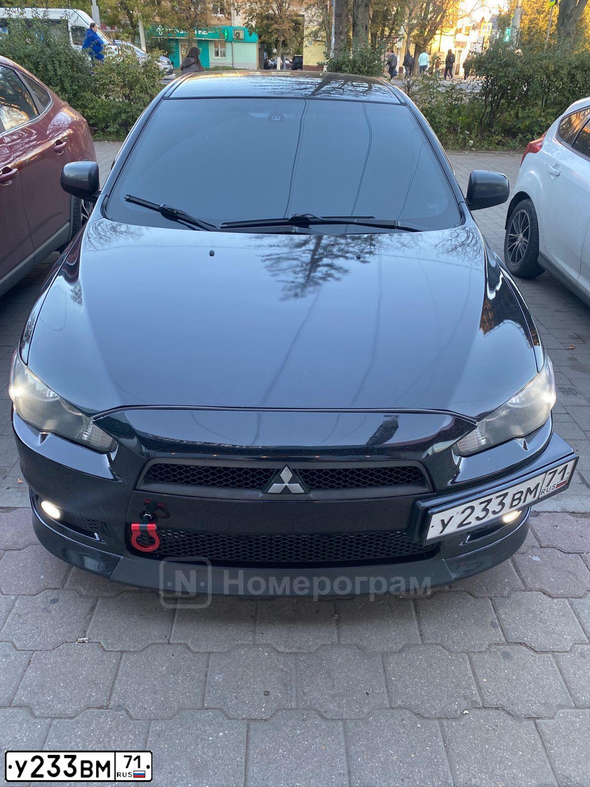 Фото автомобиля MITSUBISHI LANCER, 2008 — госномер У233ВМ71. Цвет: ЧЕРНЫЙ