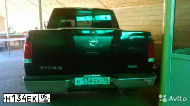 Фото автомобиля NISSAN TITAN, 2004 — госномер М124СР123. Цвет: ЧЕРНЫЙ