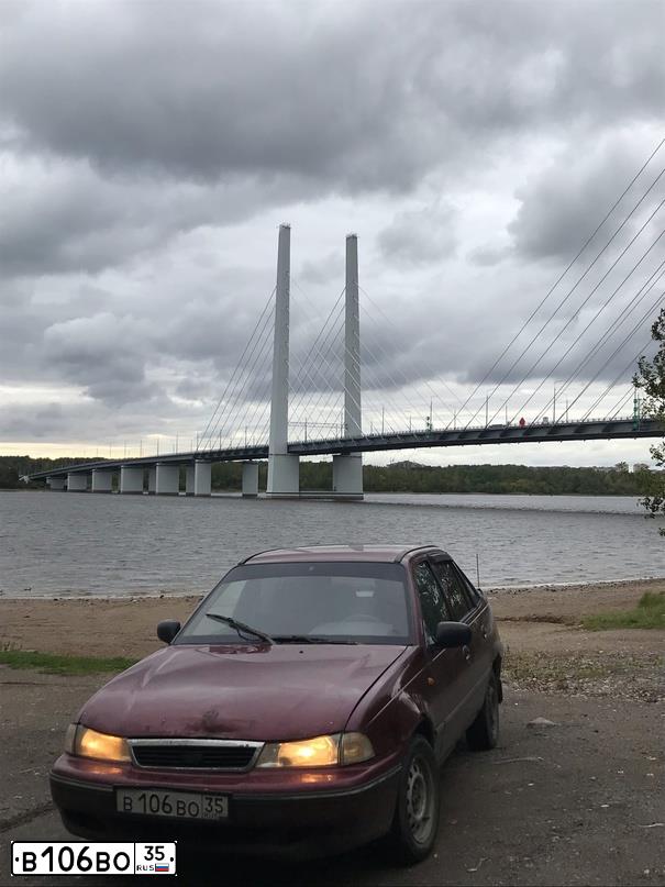 Фото автомобиля DAEWOO NEXIA, 2005 — госномер В106ВО35. Цвет: СПЕЛАЯ ВИШНЯ