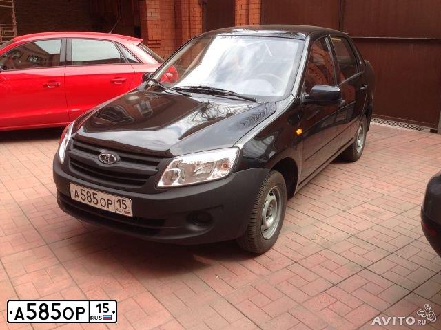 Фото автомобиля LADA GRANTA, 2013 — госномер Е364КА15. Цвет: ЧЕРНЫЙ