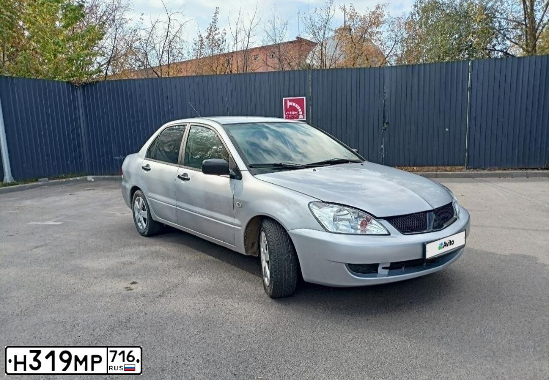 Фото автомобиля MITSUBISHI LANCER, 2004 — госномер М270КК702. Цвет: СЕРЕБРИСТЫЙ