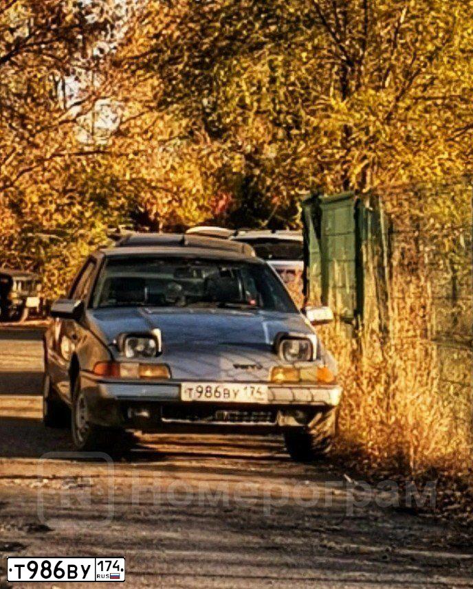 Фото автомобиля VOLVO 480, 1989 — госномер Х393КЕ774. Цвет: СЕРЫЙ