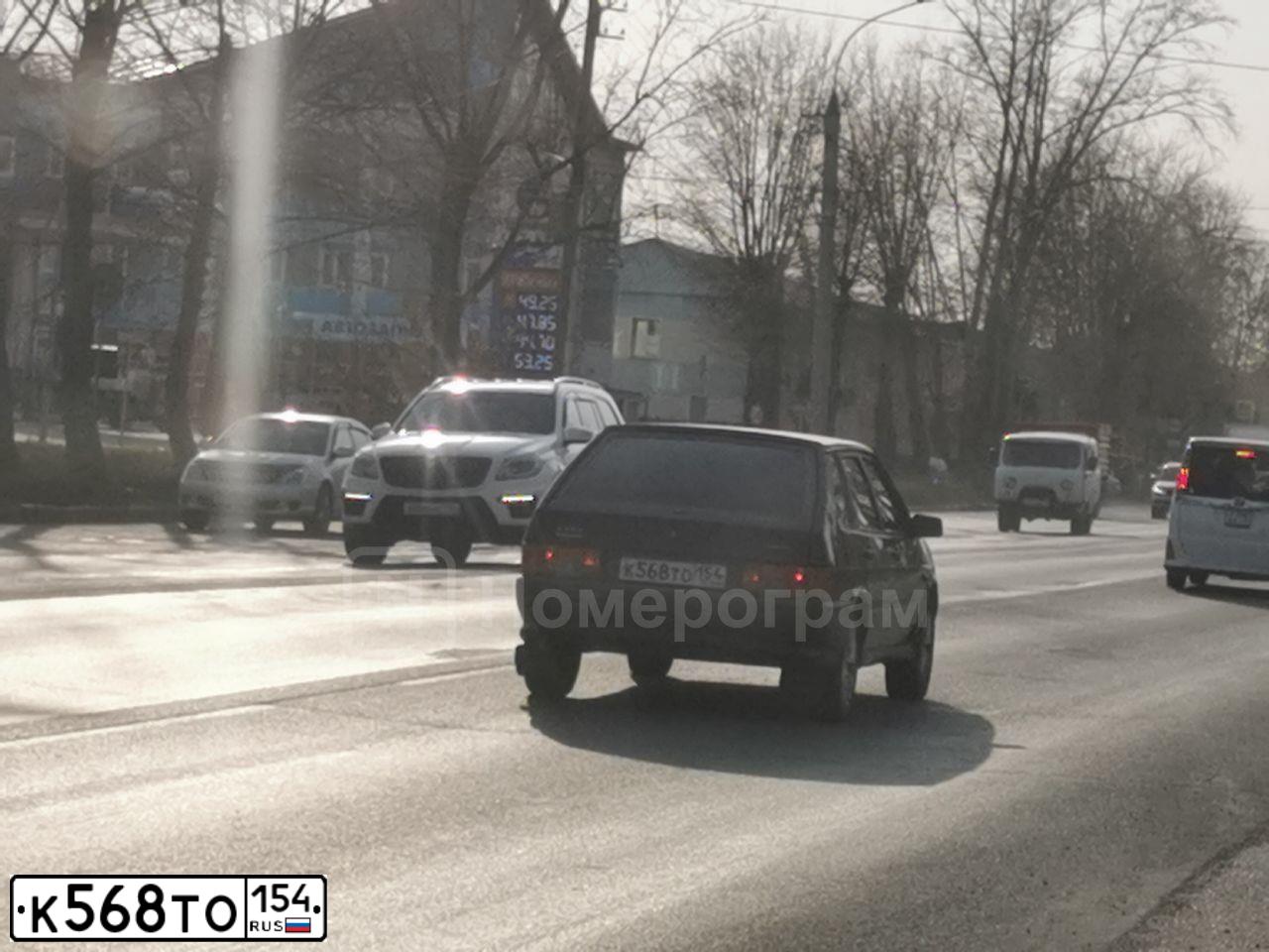 Фото автомобиля LADA 2114 SAMARA, 2013 — госномер Н222КС154. Цвет: Сине-Черный