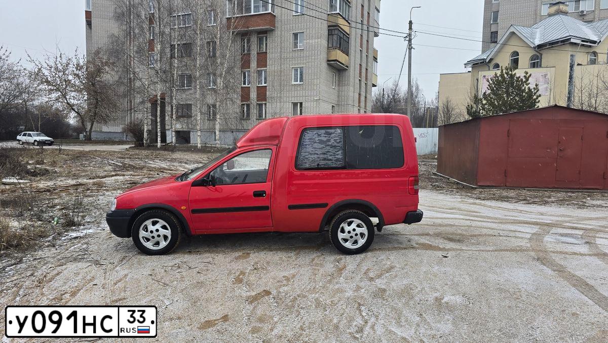 Фото автомобиля OPEL COMBO, 2000 — госномер Р217КМ977. Цвет: Красный