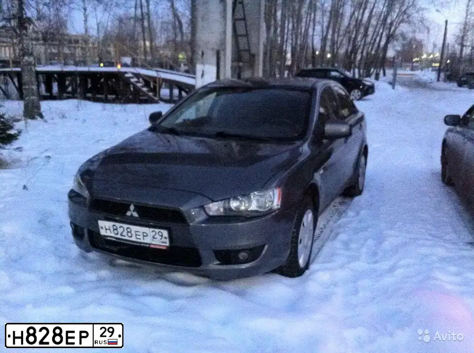 Фото автомобиля MITSUBISHI LANCER, 2007 — госномер Н828ЕР29. Цвет: Серый