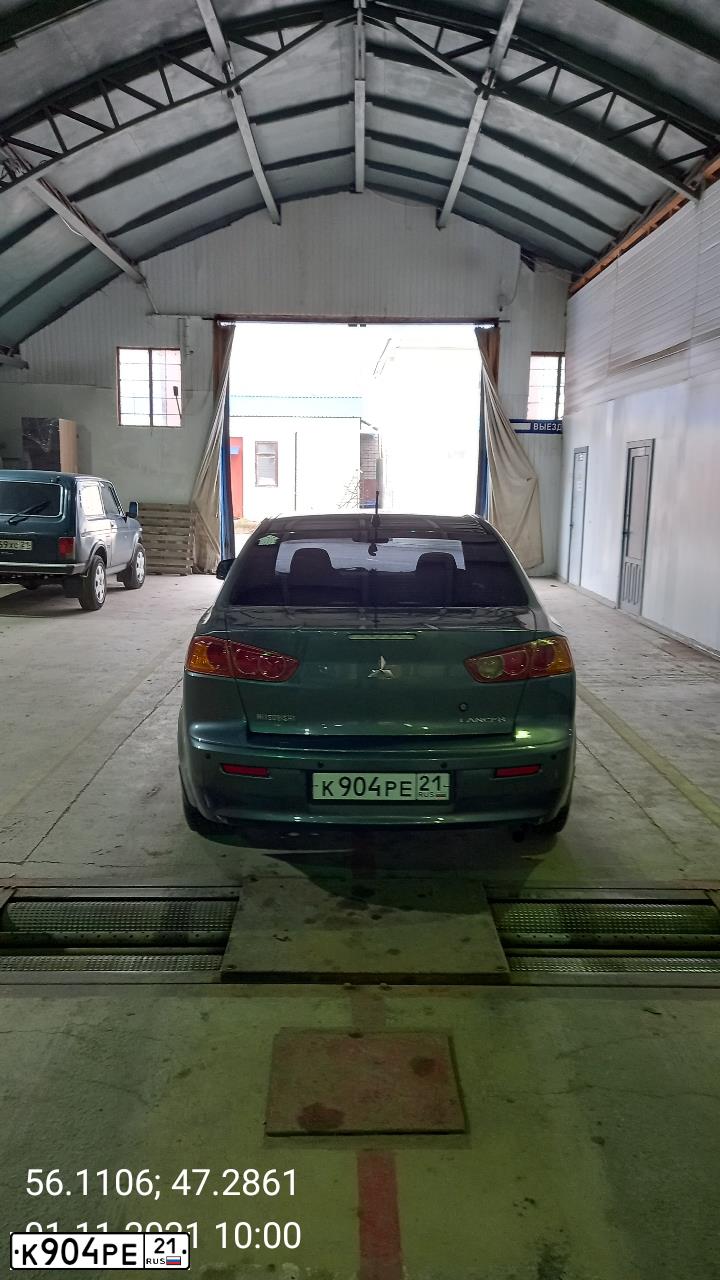 Фото автомобиля MITSUBISHI LANCER, 2008 — госномер К904РЕ21. Цвет: СЕРЫЙ