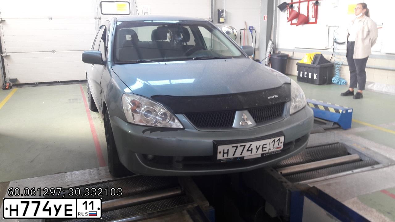 Фото автомобиля MITSUBISHI LANCER, 2006 — госномер Н774УЕ11. Цвет: СВЕТЛО-СЕРО-ЗЕЛЕНЫЙ