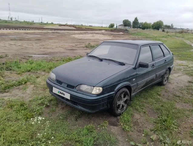 Фото автомобиля LADA 2114 SAMARA, 2007 — госномер Х228МТ64. Цвет: ТЕМНО ЗЕЛЕНЫЙ