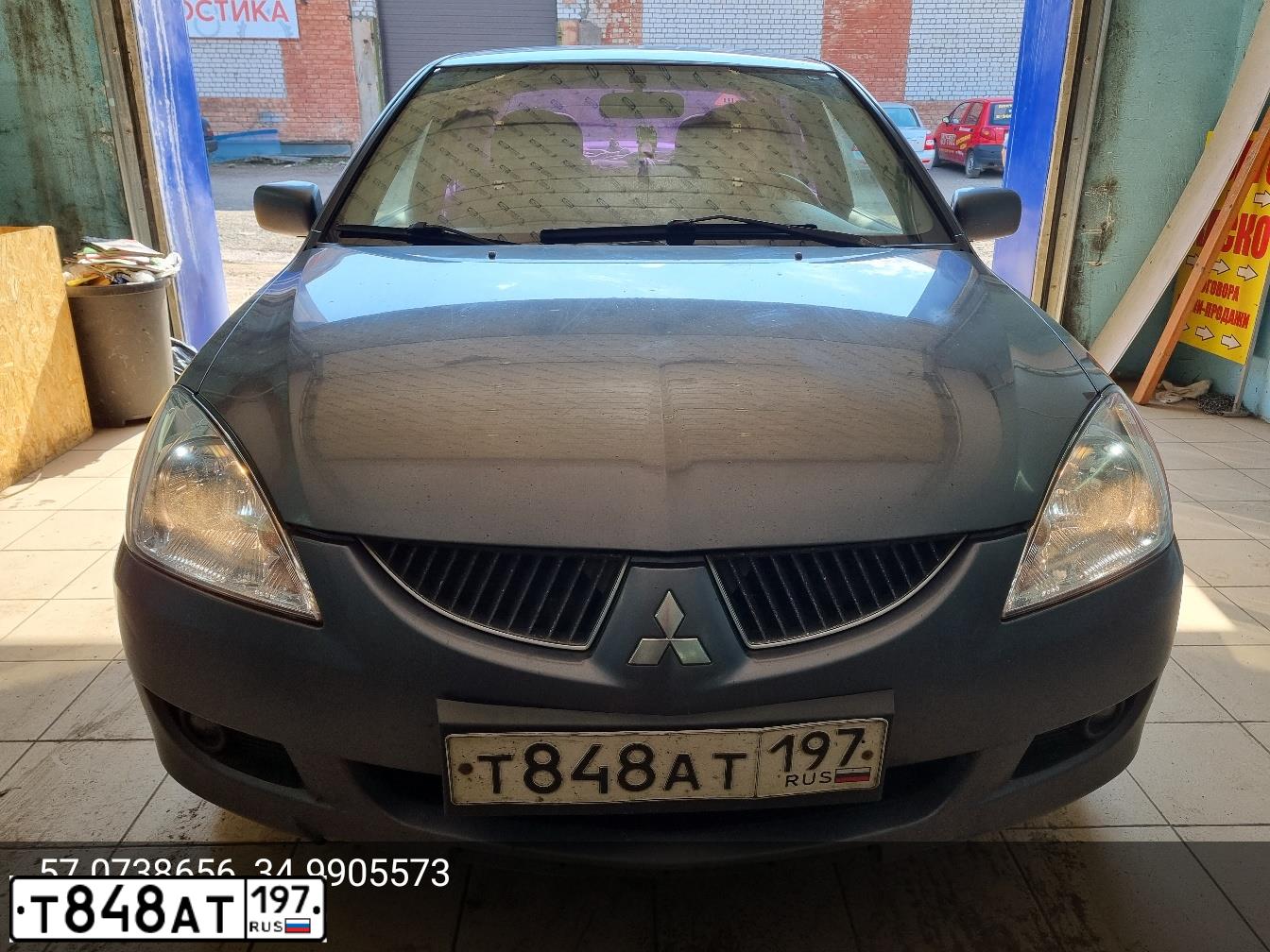 Фото автомобиля MITSUBISHI LANCER, 2005 — госномер Х025ЕО977. Цвет: СЕРЫЙ МЕТАЛЛИК