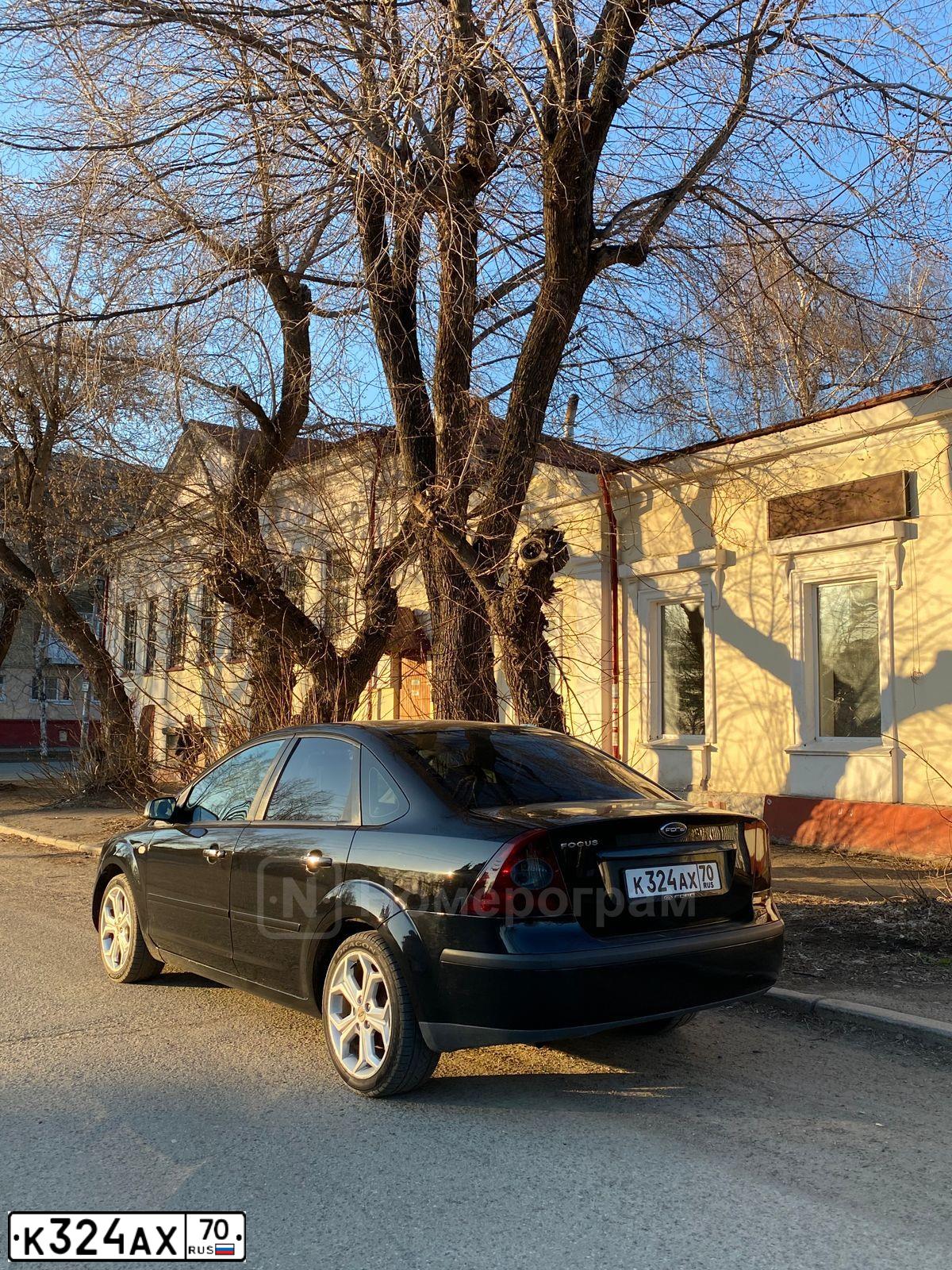 Фото автомобиля FORD FOCUS, 2007 — госномер Н222СА70. Цвет: ЧЕРНЫЙ