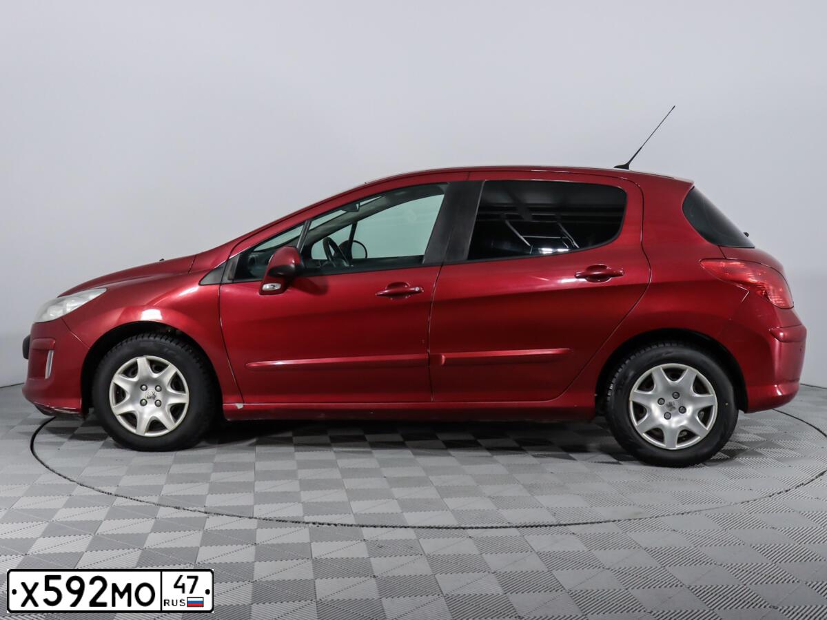 Фото автомобиля PEUGEOT 308, 2009 — госномер М202РТ198. Цвет: Красный