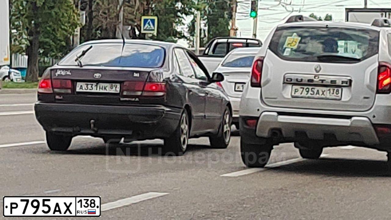 Фото автомобиля RENAULT DUSTER, 2016 — госномер Р795АХ138. Цвет: СВЕТЛО-СЕРЫЙ