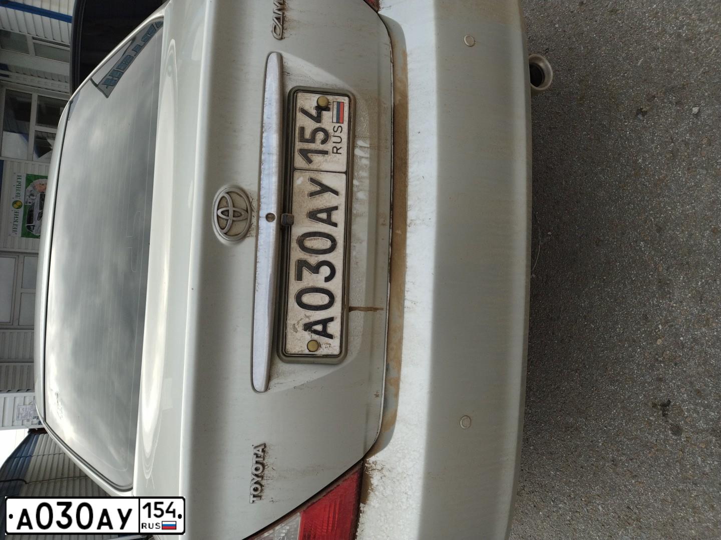 Фото автомобиля TOYOTA CAMRY, 2002 — госномер Н651ХА54. Цвет: СЕРЫЙ