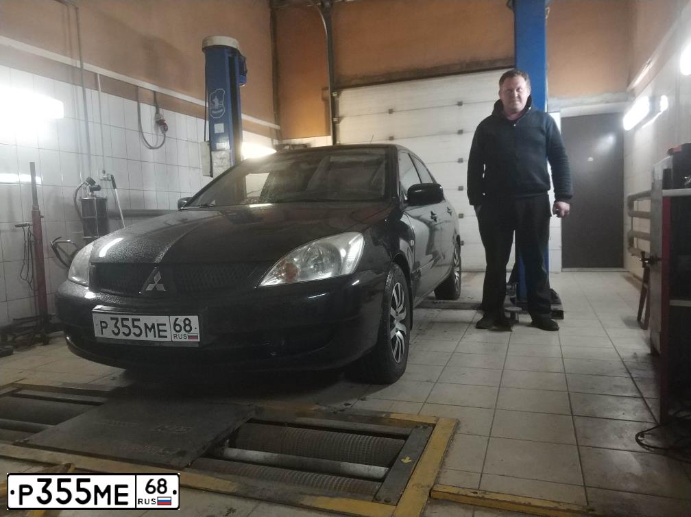Фото автомобиля MITSUBISHI LANCER, 2009 — госномер К700УС68. Цвет: ЧЕРНЫЙ
